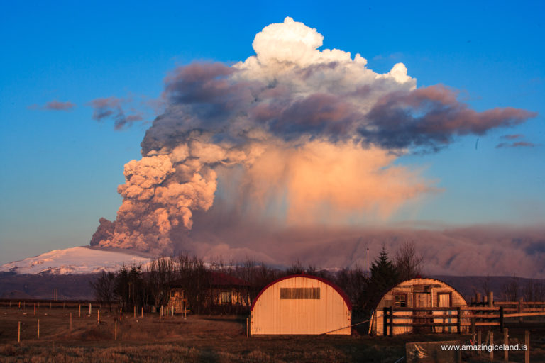 Ash cloud and farm in the 2010 eruption of Eyjafjallajokull volcano on the south coast of Iceland