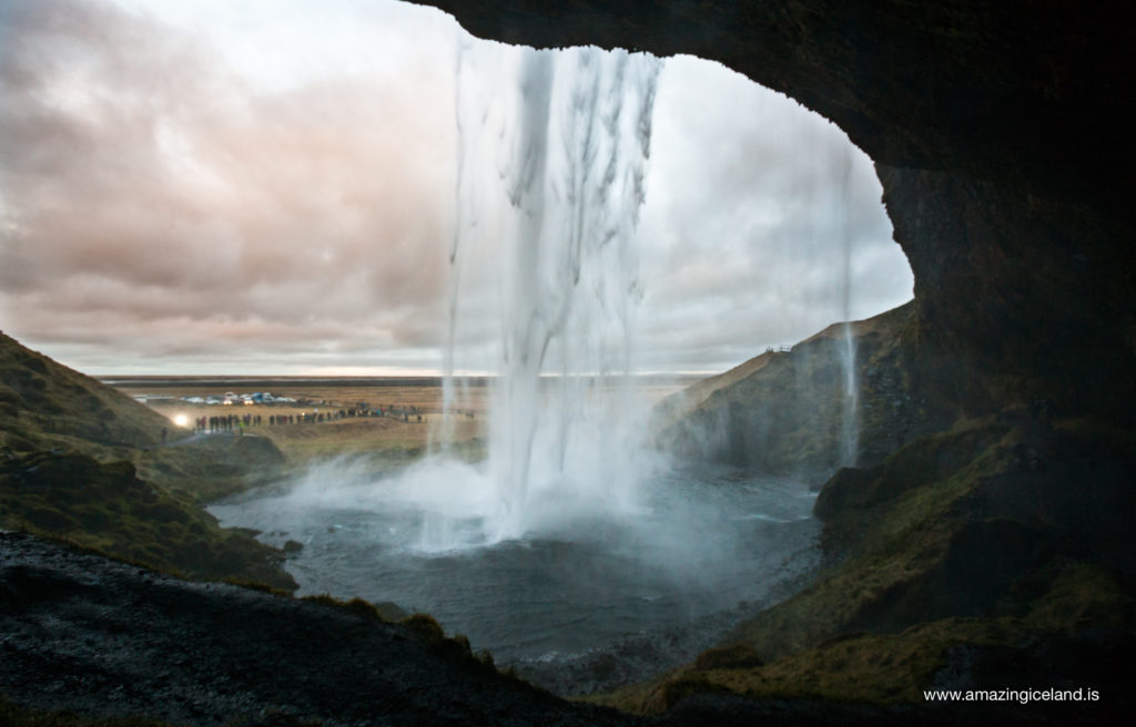 Behind Seljalandsfoss waterfall on south coast of Iceland