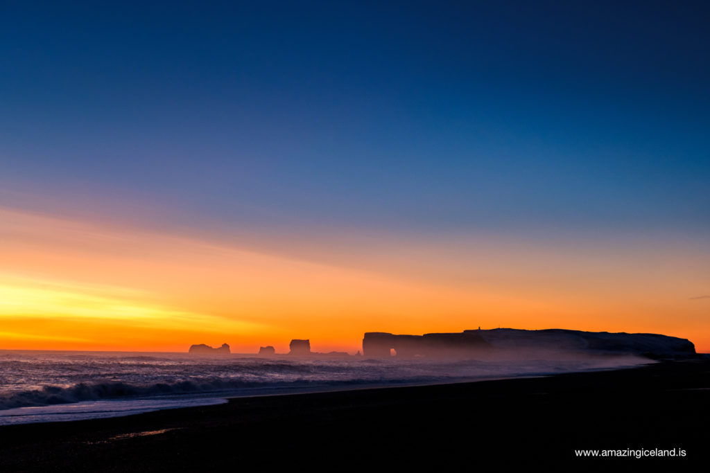Dyrholaey island and black sand beach at sunset