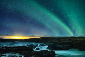 northern lights over Urriðafoss waterfall