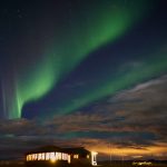 Northern lights over restaurant on south coast of Iceland