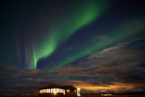 Northern lights over restaurant on south coast of Iceland