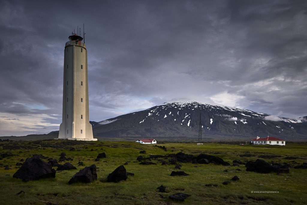 The lighthouse at Malarrif wit snæfellsjökull glacier volcano in Snæfellsnes Iceland