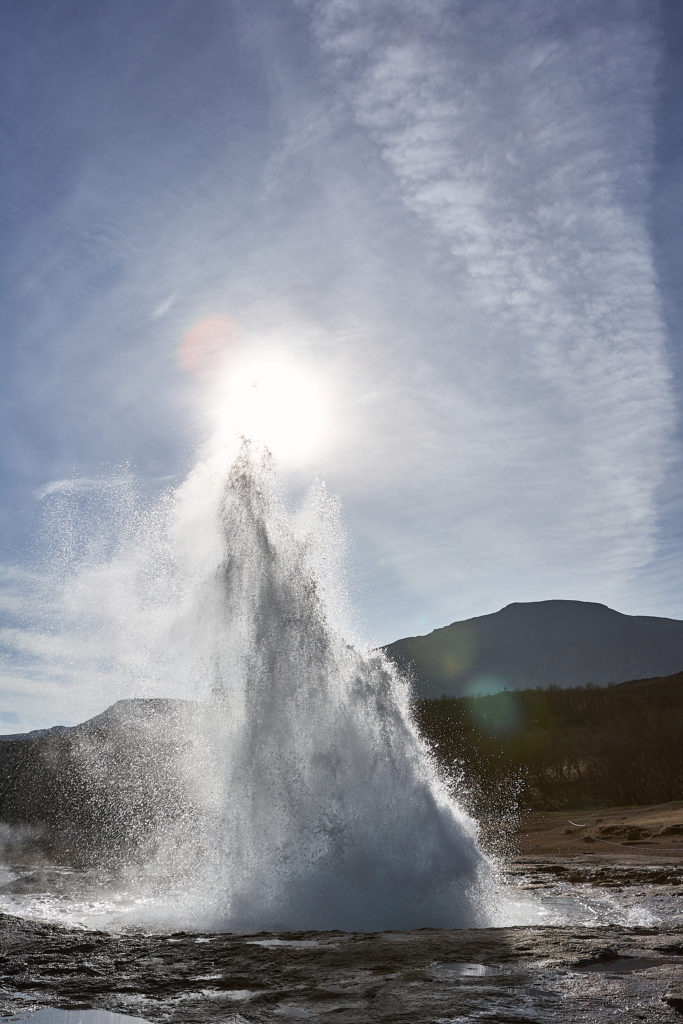 The geysir Strokkur starting to erupt on the golden circle in Iceland