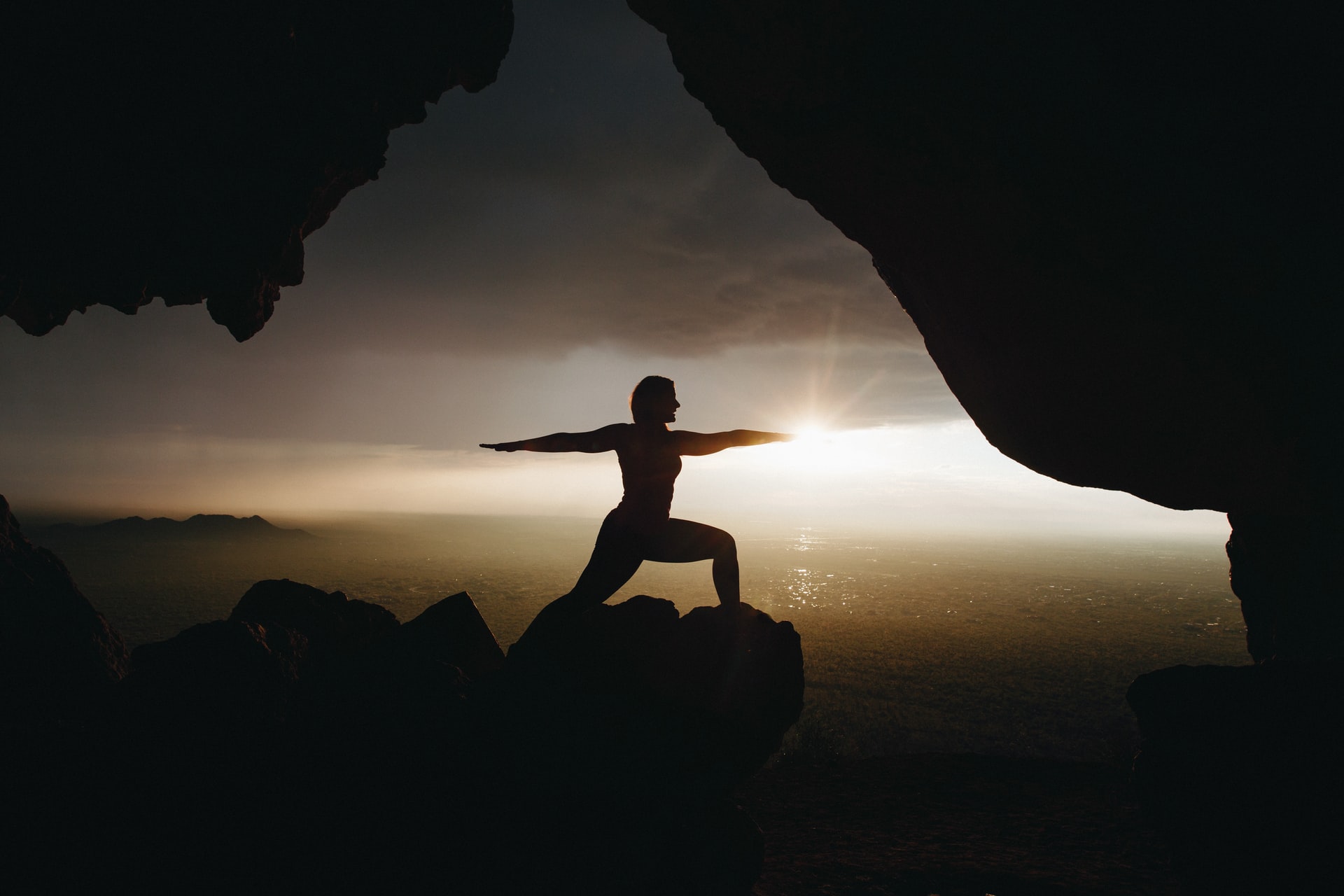 Yoga on mountain top at sunset