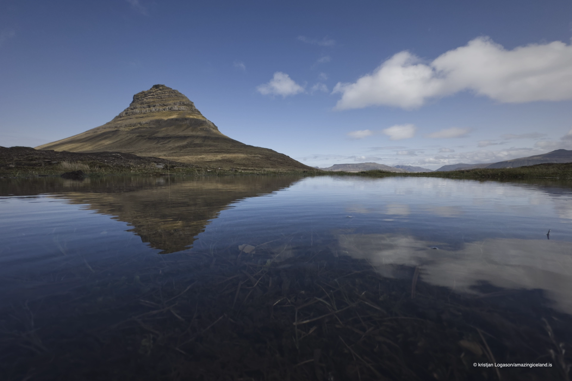 Reflection of The mountain Kirkjufell in a pool of water
