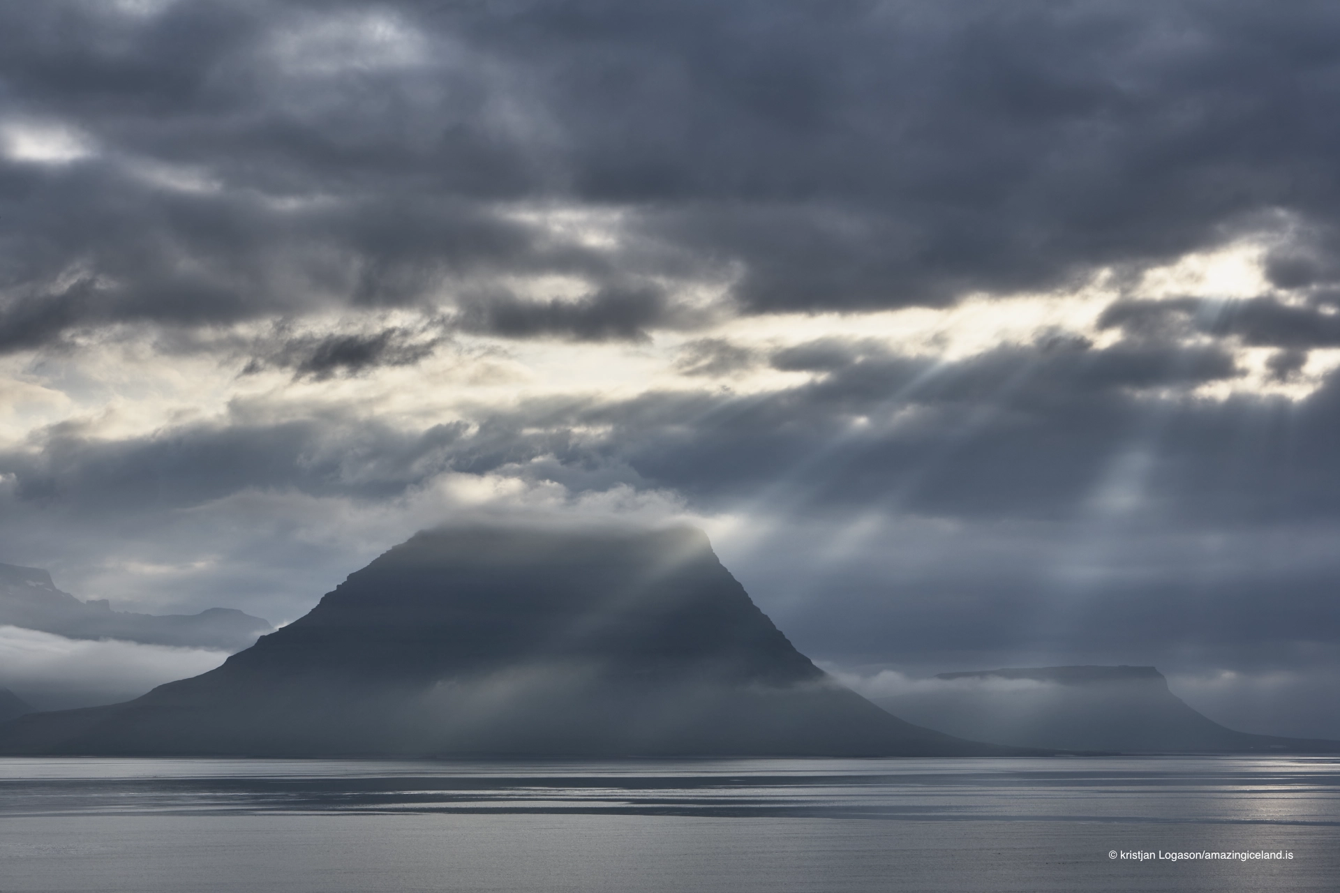 Sunrays and clouds over Mt. Kirkjufell