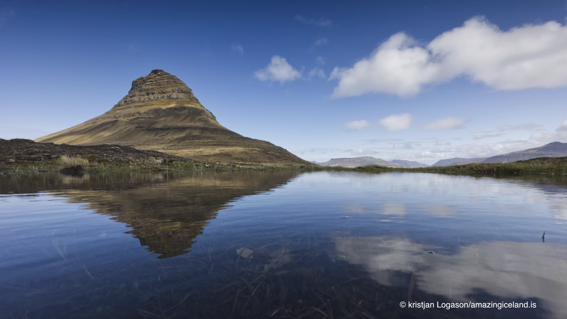 Mt Kirkjufell with a reflection in a pool