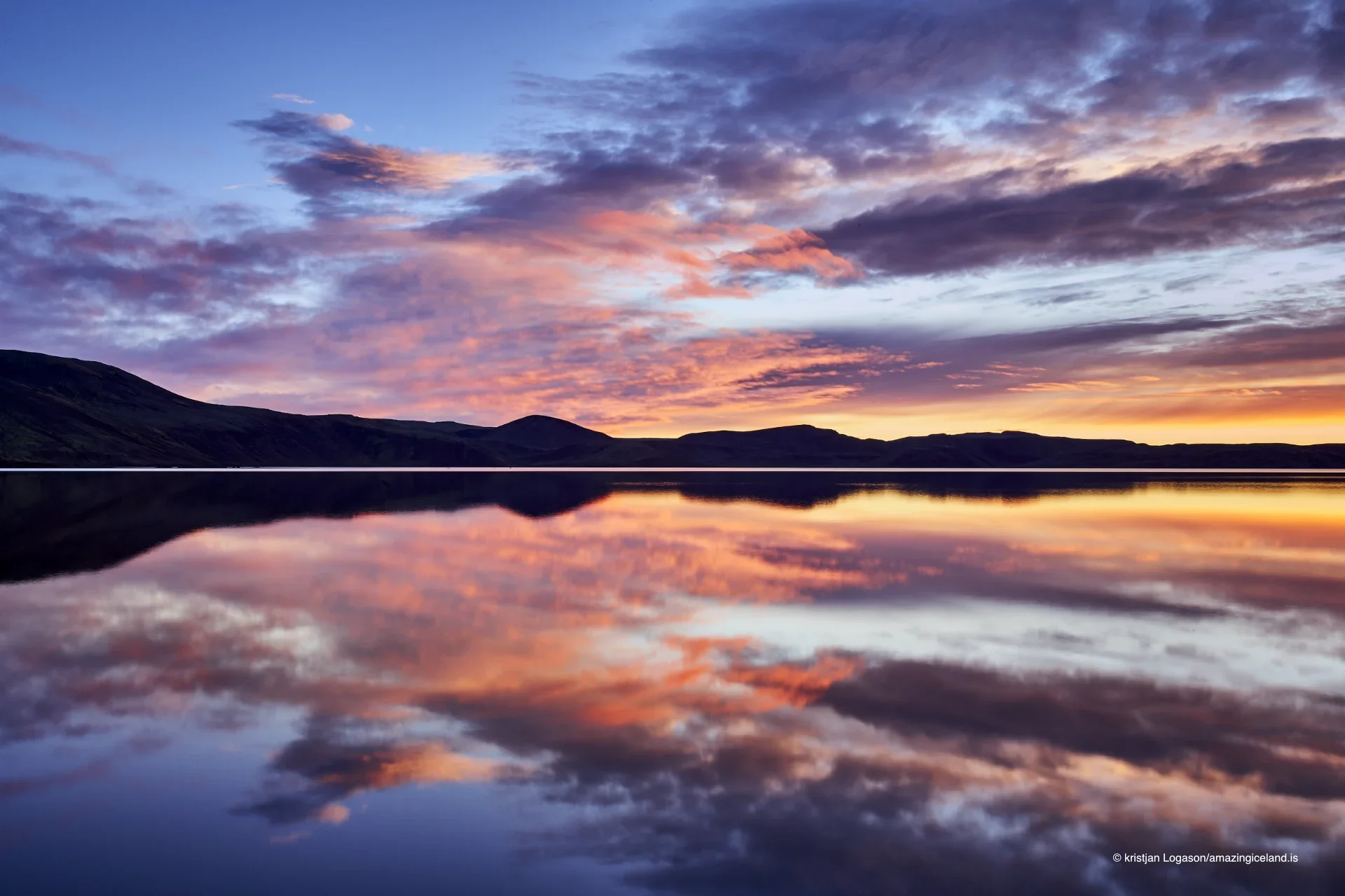 Reflection of a colorful sunset on Lake Kleifarvatn in Reykjanes peninsula in Iceland