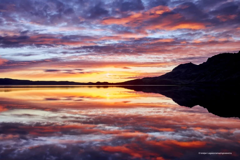 Reflection of a colorful sunset on Lake Kleifarvatn in Reykjanes peninsula in Iceland