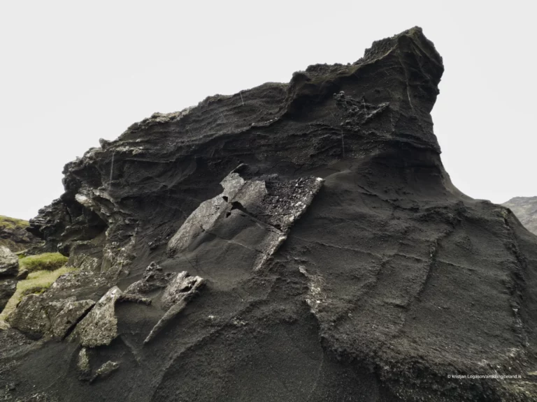 Weathered rocks by lake Kleifarvatn creating sculpture like formations