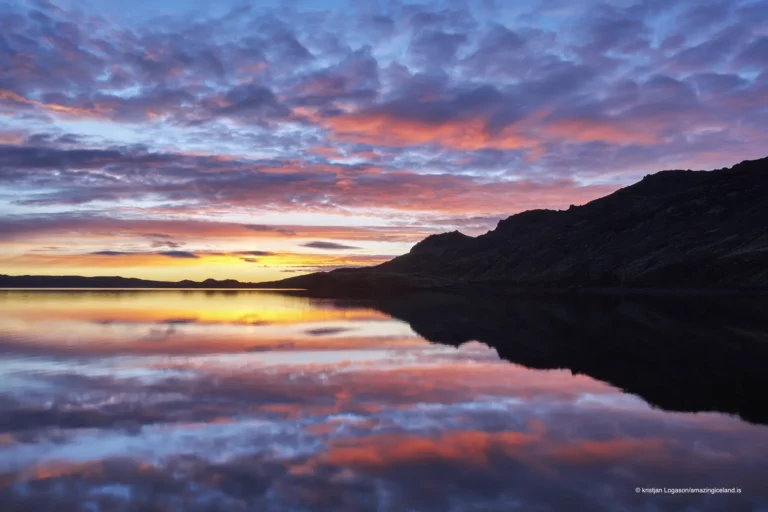 Reflection of a colorful sunset on Lake Kleifarvatn in Reykjanes peninsula in Iceland