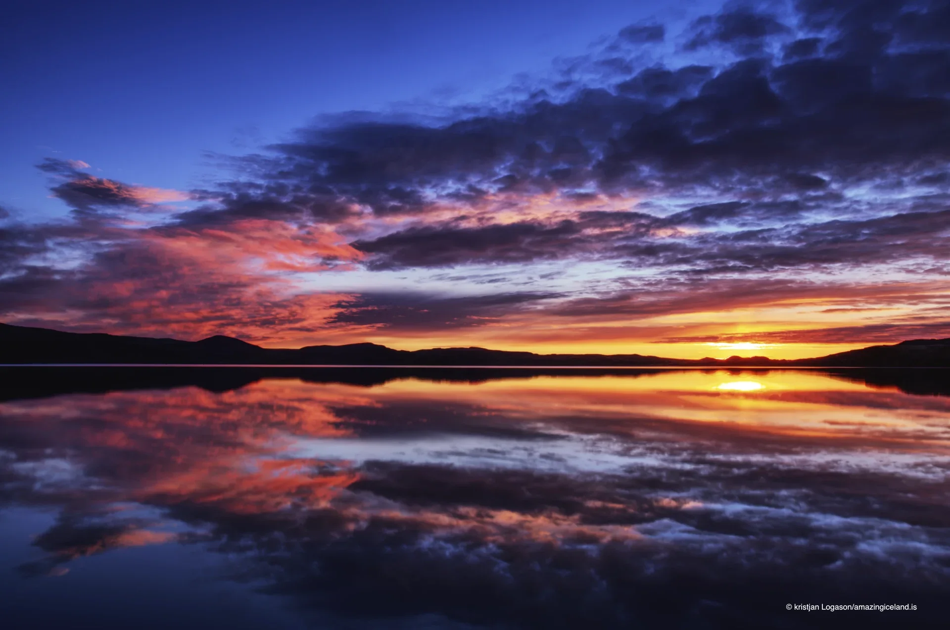 Reflection of a colorful sunset on Lake Kleifarvatn in Reykjanes peninsula in Iceland