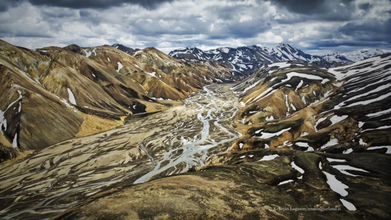 Landmannalaugar is one of Iceland’s most geologically expressive landscapes: a highland basin of rhyolite mountains, lava fields, geothermal activity, and braided rivers within the Fjallabak Nature Reserve. Located at the northern end of F208, the area is internationally known for its colour-rich mountains and natural hot spring, but its deeper significance lies in how clearly it reveals the interaction between volcanism, tectonics, water, and time.