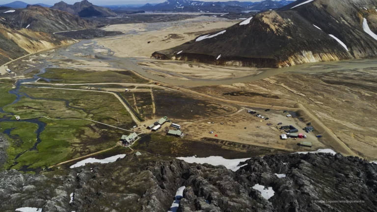 Landmannalaugar is one of Iceland’s most geologically expressive landscapes: a highland basin of rhyolite mountains, lava fields, geothermal activity, and braided rivers within the Fjallabak Nature Reserve. Located at the northern end of F208, the area is internationally known for its colour-rich mountains and natural hot spring, but its deeper significance lies in how clearly it reveals the interaction between volcanism, tectonics, water, and time.