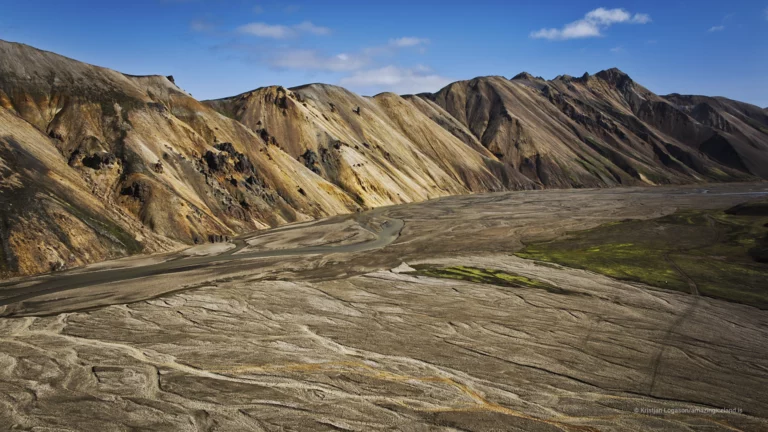 Landmannalaugar is one of Iceland’s most geologically expressive landscapes: a highland basin of rhyolite mountains, lava fields, geothermal activity, and braided rivers within the Fjallabak Nature Reserve. Located at the northern end of F208, the area is internationally known for its colour-rich mountains and natural hot spring, but its deeper significance lies in how clearly it reveals the interaction between volcanism, tectonics, water, and time.