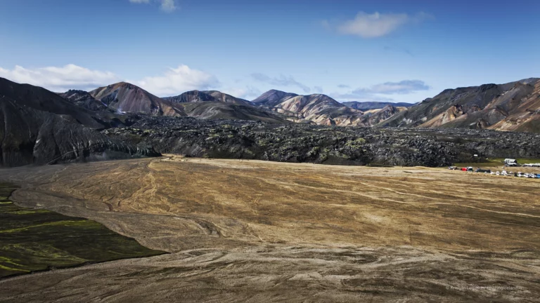 Landmannalaugar is one of Iceland’s most geologically expressive landscapes: a highland basin of rhyolite mountains, lava fields, geothermal activity, and braided rivers within the Fjallabak Nature Reserve. Located at the northern end of F208, the area is internationally known for its colour-rich mountains and natural hot spring, but its deeper significance lies in how clearly it reveals the interaction between volcanism, tectonics, water, and time.