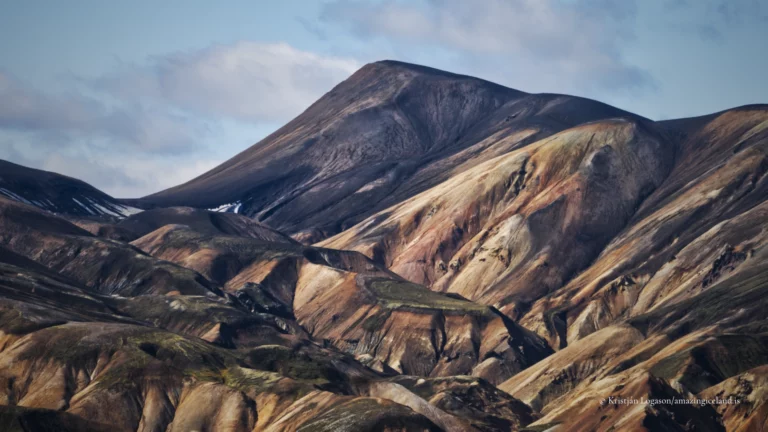 Landmannalaugar is one of Iceland’s most geologically expressive landscapes: a highland basin of rhyolite mountains, lava fields, geothermal activity, and braided rivers within the Fjallabak Nature Reserve. Located at the northern end of F208, the area is internationally known for its colour-rich mountains and natural hot spring, but its deeper significance lies in how clearly it reveals the interaction between volcanism, tectonics, water, and time.