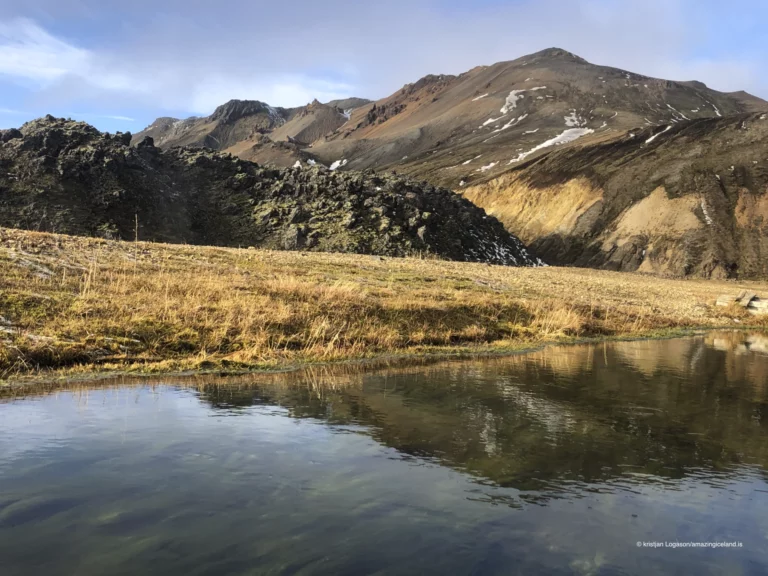 Laugahraun is a young basaltic lava field at Landmannalaugar, formed during the 1477 Veiðivötn eruption. Dark, fractured, and still sharply textured, it stands in direct contrast to the surrounding rhyolite mountains and geothermal slopes. More than a backdrop, Laugahraun is a defining structural element of the Landmannalaugar landscape, shaping access, water flow, and human movement through the area.